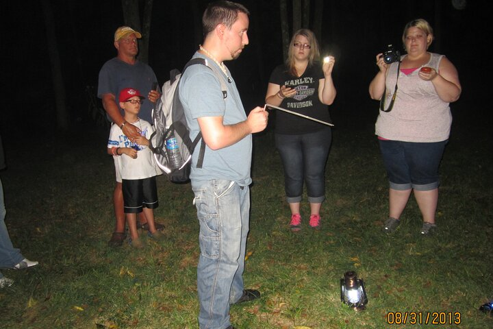 A group performs a dowsing rods session